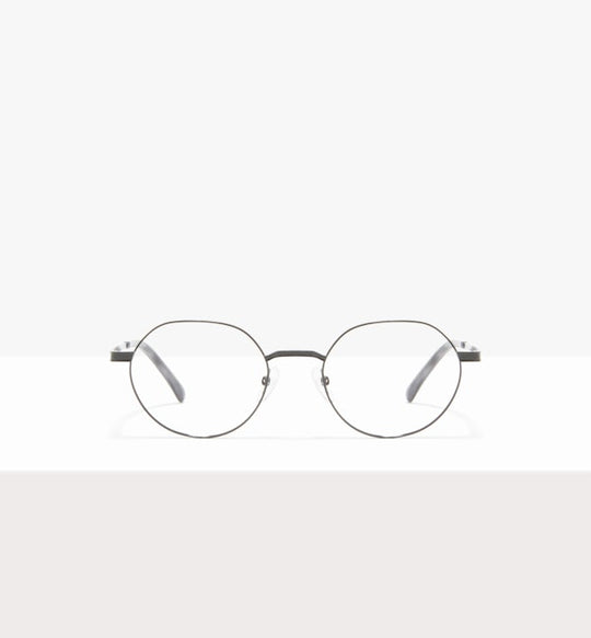 Round eyeglasses with thin, metal frames on a white surface.