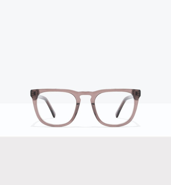 Transparent fashion glasses with rectangular frames on a white surface.